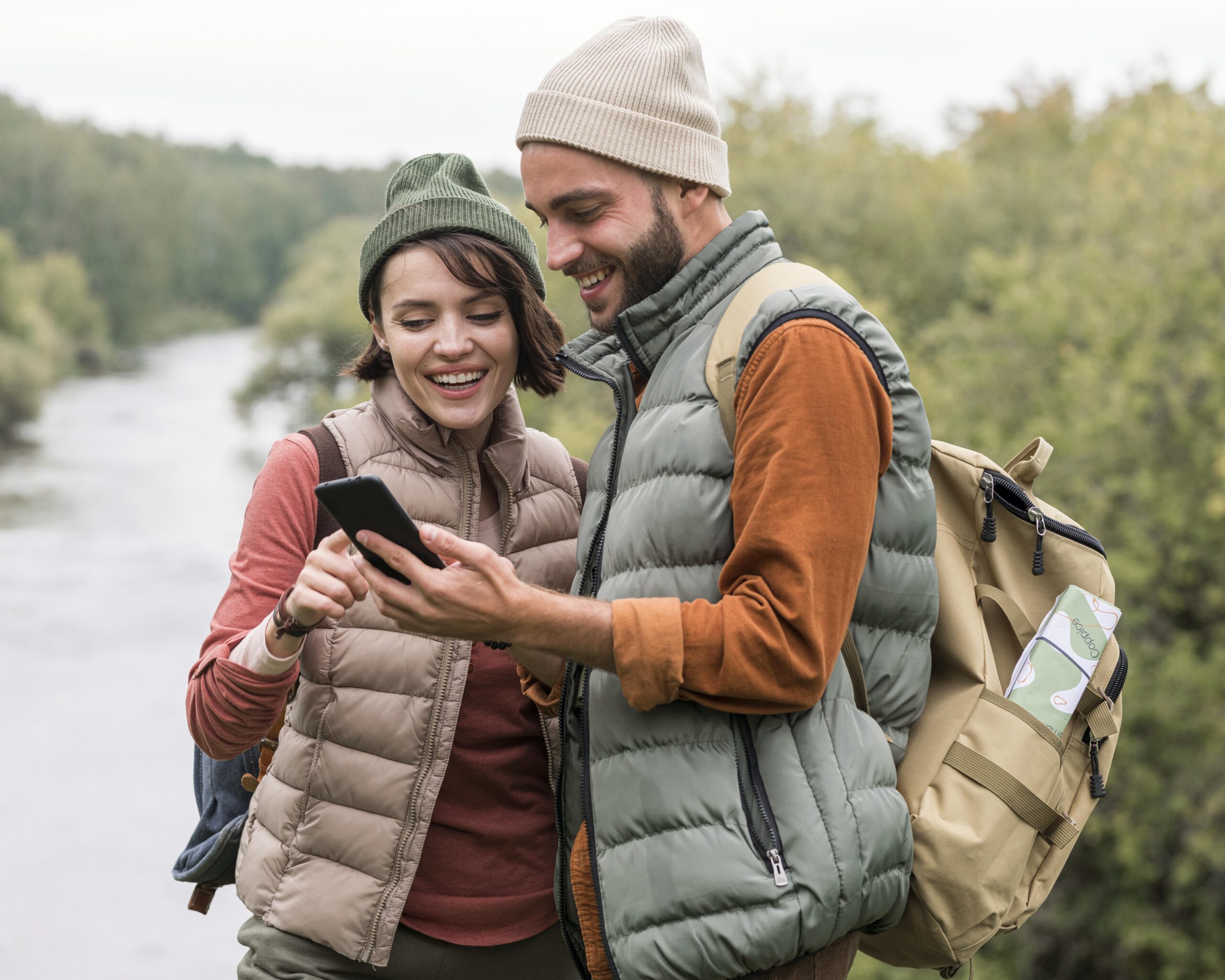 couple looking phone nature