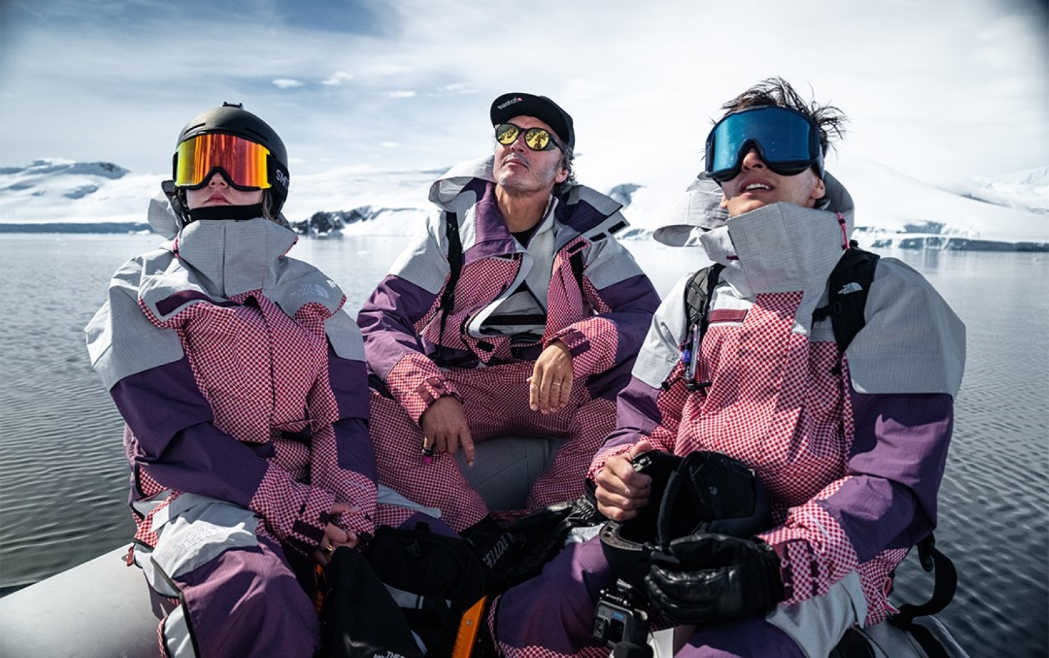 Троє чоловіків у одежі The North Face